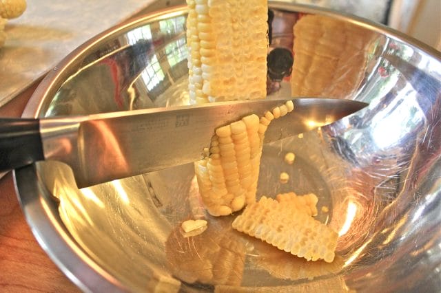 taking corn kernels off the ear