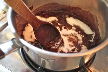 adding sugar to the brownies