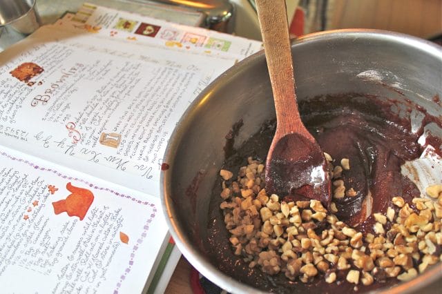 adding walnuts to the brownies