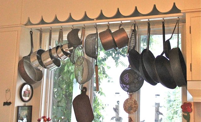 Just hanging around.hubby put up pipe to hang our cast iron at the lake  house. I love how it turned out. We have very limited storage in the  kitchen, this helps so
